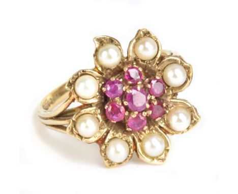 A 9ct yellow gold cultured pearl floral set ring, size O, approx 4.2g.Additional InformationThe pink stones appear to be rubi