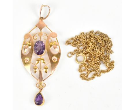 A 9ct yellow gold Art Nouveau pierced pendant with leaf design and purple stones, length 5.2cm, also a fine link chain, combi