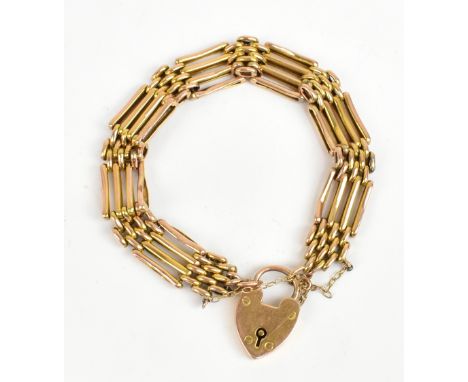 A 9ct yellow gold gate link bracelet with heart shaped padlock clasp and safety chain, approx 16.1g.Additional InformationThe