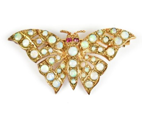 A 9ct yellow gold opal butterfly brooch, width 4cm, approx 4.8g.Additional InformationThere are the usual signs of wear with 