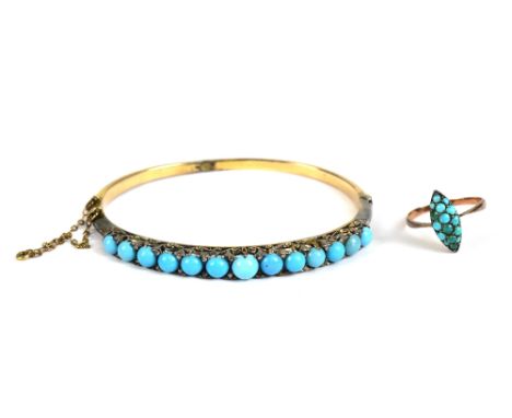 A Victorian yellow metal turquoise set hinged snap bangle and a yellow metal and turquoise ring, marked 9c, approx 2.1g (2).A