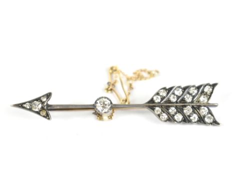 An unmarked white metal brooch formed as Cupid's arrow set with diamonds including approx 0.2cts stone to centre, unmarked, l
