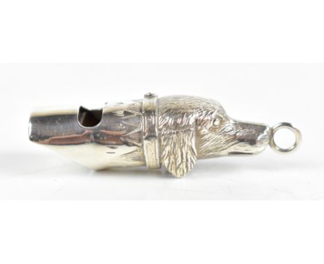 AN; an Elizabeth II hallmarked silver dog whistle modelled in the form of a pointer dog's head, London 1998, length 5cm, appr