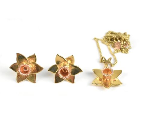 CLOGAU; a 9ct yellow and rose gold daffodil pendant, length 2.5cm, on 9ct curb link chain, length 42cm, and a pair of matchin
