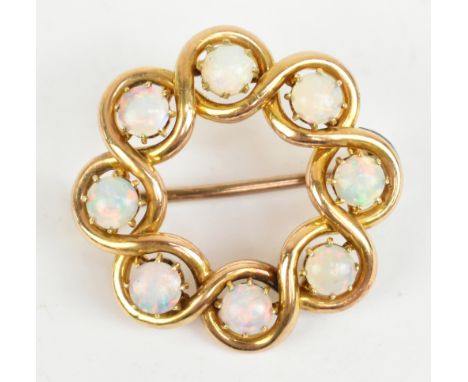 A 15ct yellow gold and opal circular brooch, diameter 2.5cm, approx 4.9g.Additional InformationThere are a few tiny chips to 