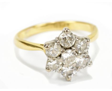 An 18ct yellow gold diamond daisy cluster ring, the central diamond approx 0.15cts, size J/K, approx 2.8g.Additional Informat