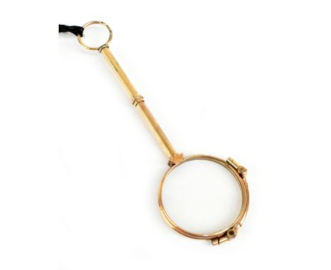 A pair of gold plated lorgnettes with spring action to the clasp on the handle, length 13cm.Additional InformationPresented i