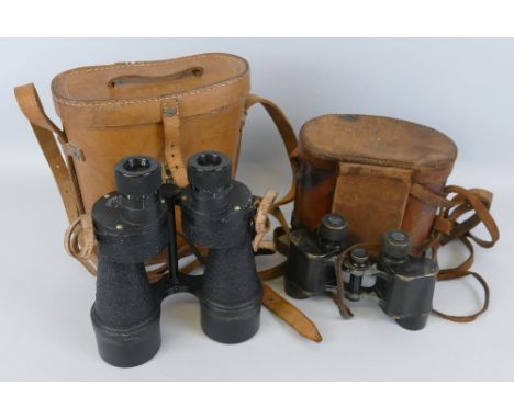 A pair of Ross London binoculars, marked Bino. Prism No.5 Mk II No.92076, in leather carrying case with impressed broad arrow