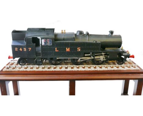 A 31/2" gauge live steam class 4P 2-6-4 tank locomotive, No.2437 with LMS livery 91cm long displayed on track under glazed co