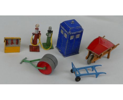 Dinky - seven die-cast accessories, comprising Theo petrol pump, Bowser petrol pump, Police Box, oil bin, garden roller, whee
