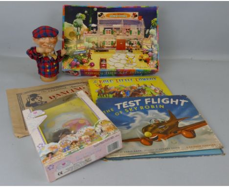 A Louis Marx Walt Disney's Dream House, a Charlie Chaplin Dancing Charlie illusion, in original bag, two books etc