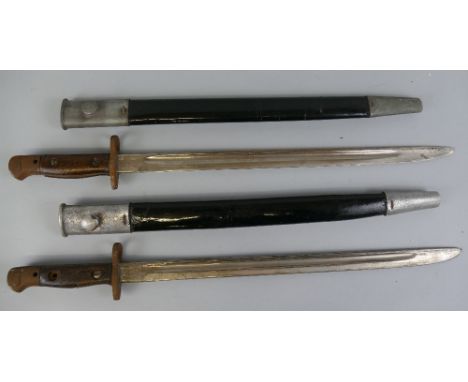 Two British Pattern 1907 bayonets, one blade marked Vickers the other Wilkinson, both with scabbards (2)