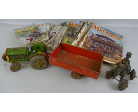 A Mettoy Playthings tin-plate tractor and trailer, 43.5cm long, an Eastern cast metal figure of a man riding an elephant on w