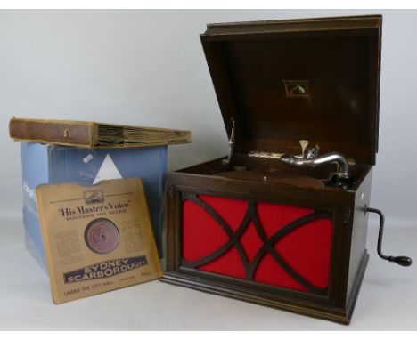 An HMV oak cased table top gramophone, with in-built fretworked speaker, two tins of needles and a quantity of 78rpm records,