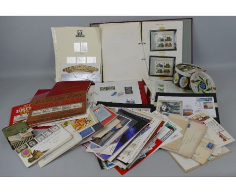 Three albums of modern mint stamps, with good postal value, various First Day Covers, PHQ cards etc
