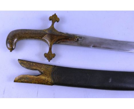 An Indian tulwar, the 77cm curving steel blade with traces of decoration, the iron hilt with ornate quillons, pistol grip and