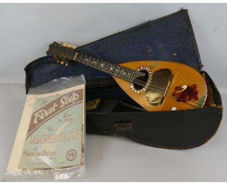 A late 19th century Italian lute back mandolin, with banded rosewood back and neck and sprucewood top, bears label "Giuseppe 