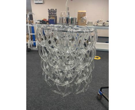 A contemporary glass ceiling light with glass drop shades 