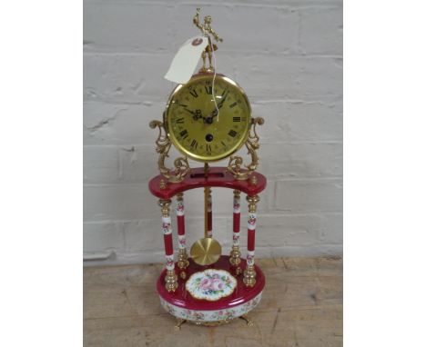 An Italian china and brass mantel clock with pendulum 