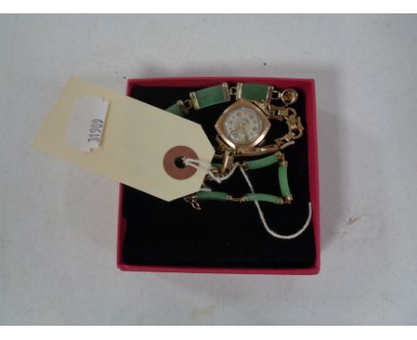 A 9ct gold lady's Arnex watch on rolled gold bracelet together with a jade silver bracelet 