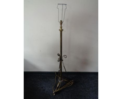 An early 20th century brass standard lamp 