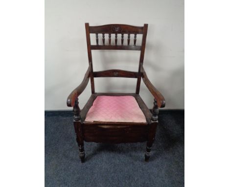 An Edwardian commode armchair 