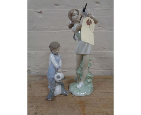 A Lladro figure number 6974 - boy with soft toy together with a Nao figure of a golfer 