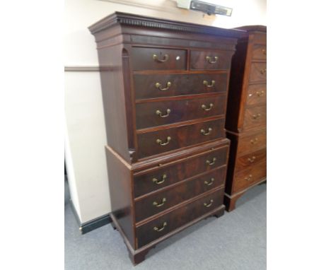 A George III mahogany chest on chest on bracket feet 