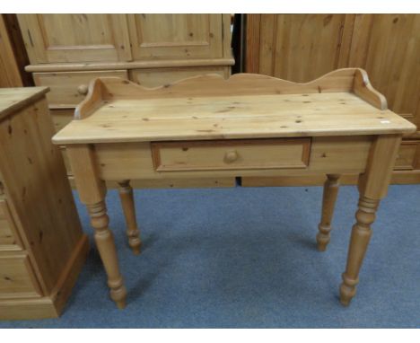 A pine console table fitted a drawer 