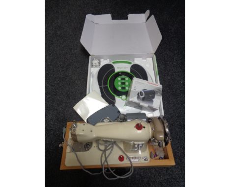 A Jones electric sewing machine, circulation booster and a Thompson digital video camera 