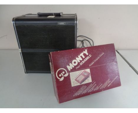 A Sanyo stereophonic reel to reel tape recorder together with a boxed Monty electronic scrabble 