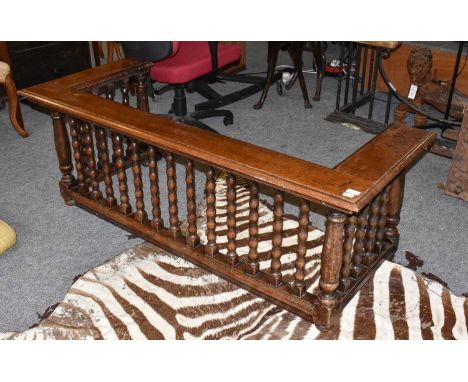 A late 19th/early 20th century oak club fender with bobbin turned supports, 157cm by 64cm by 57cm