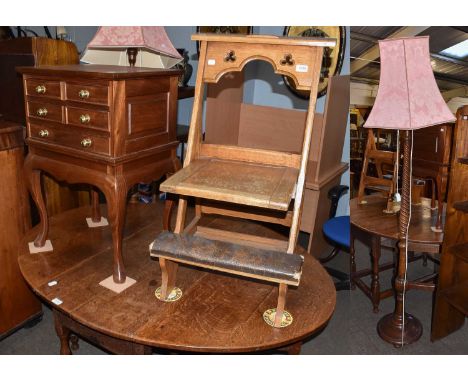 A light oak church kneeling chair, a reproduction small table cabinet, and a standard lamp