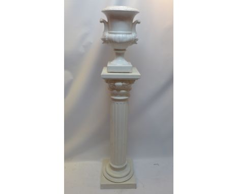 A white painted pine pedestal with reeded column raised on square base together with a white ceramic urn.  