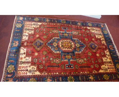 A fine North West Persian Nahawand rug, central double pendent medallion on a teracotta field with floral jade border, 195cm 