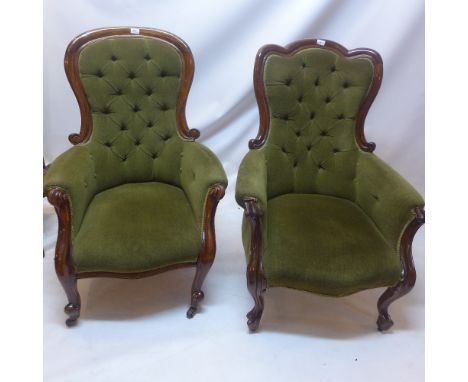 A near pair of Victorian salon chairs, mahogany and button back green upholstery, raised on casters 