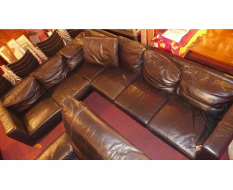 A contemporary black leather corner sofa on beech wood legs. 