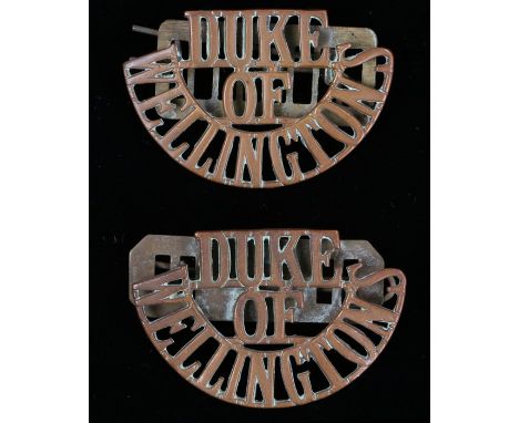 Pair of First World War shoulder titles to The Duke of Wellingtons ( West Riding Regiment) loops to the reverse,with backing 