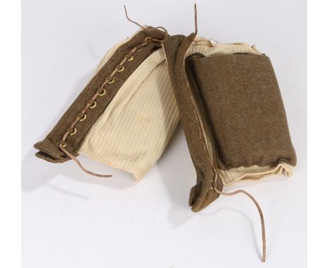 World War Two pair of British parachutists knee pads, made by Belmont and dated 1943, label marked with broad arrow, a rare p