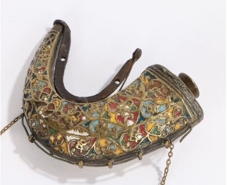 19th Century Middle Eastern crescent shape powder flask, the brass flask decorated in coloured enamels with a sprung stopper,