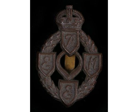 World War Two plastic economy cap badge to the Royal Electrical and Mechanical Engineers, in chocolate brown, two blades to t