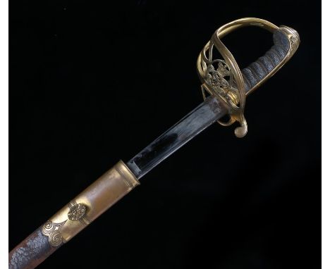 1822 pattern Victorian Officers sword, with a steel blade and gilt metal basket guard and hinged side section, with a the lea