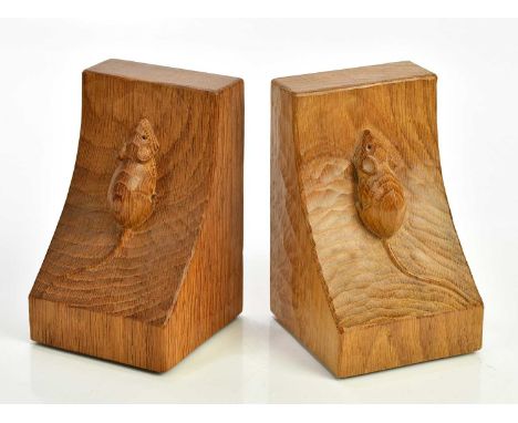 WORKSHOP OF ROBERT MOUSEMAN THOMPSON; a pair of adzed oak bookends, height 15cm.Condition Report: Light surface wear but good