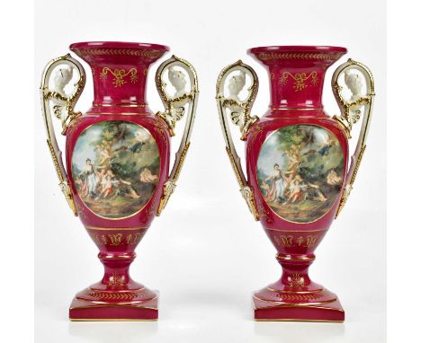 A pair of 20th century Continental porcelain twin handled pedestal vases, transfer printed with classical figures, bearing ps