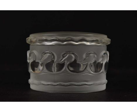 LALIQUE FRANCE; a clear and frosted glass 'Canards' trinket box and cover of circular form, signed, diameter 10cm.