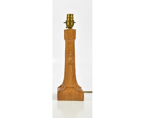 WORKSHOP OF ROBERT MOUSEMAN THOMPSON; a carved oak table lamp with adzed decoration, height excluding fitting 26cm.Condition 