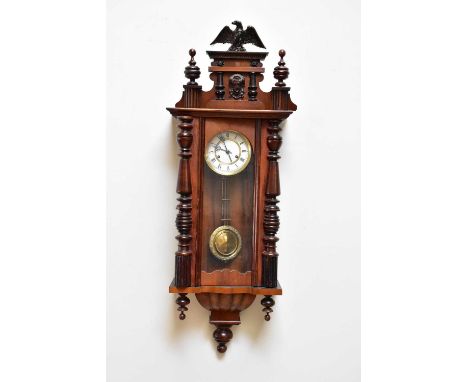 A mahogany cased Vienna style wall clock with white enamel dial set with Roman numerals, 103cm.
