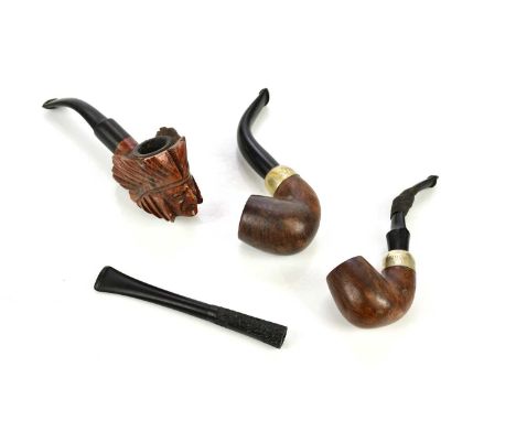 PETERSONS OF DUBLIN; a vintage pipe together with a similar example stamped K &amp; P and a briarwood carved pipe.