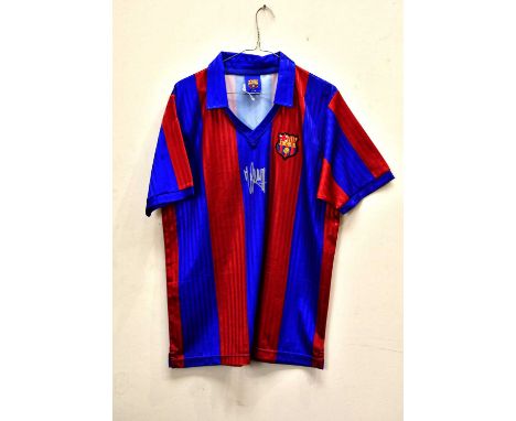 JOHAN CRUYFF; a signed Barcelona retro style football shirt, signed to front, size L.Condition Report: Light creasing through