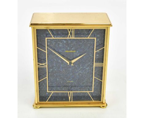 JAEGER LE COULTRE; a brass cased battery powered mantel clock with gilt Roman numerals to the perspex front and blue face, he